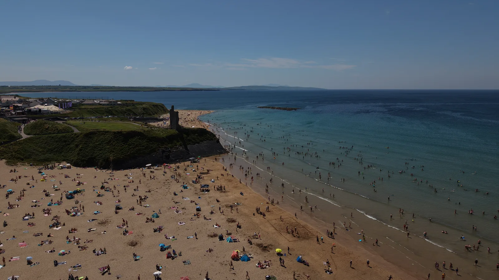 Aerial view of Ballybunion beach, castle ruins and the Atlantic on a summer day